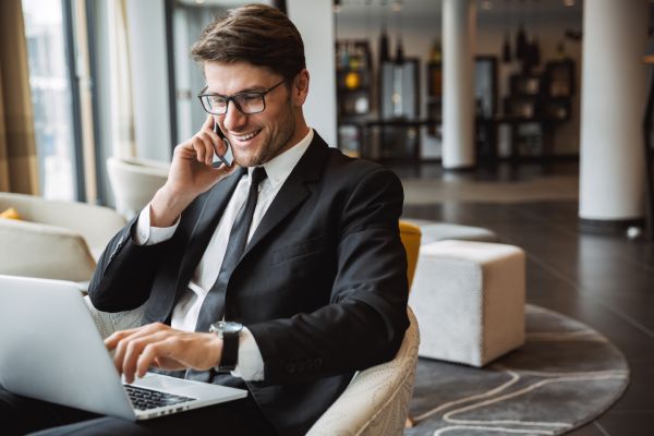 Business Man Speaking To His IAM Solutions Provider On Phone