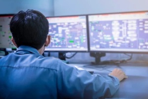 engineering works with the tablet in the production control room