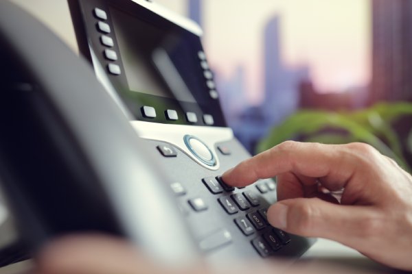 Employee Using A Customized VoIP Phone