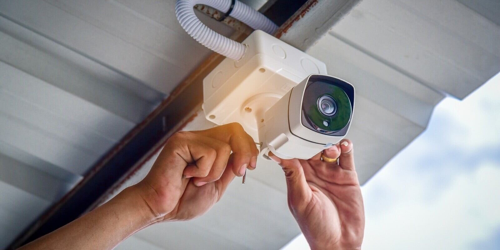 technician installing CCTV camera system for security area