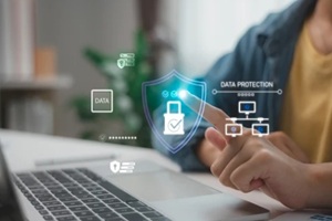 hand pointing to digital data protection interface on laptop screen