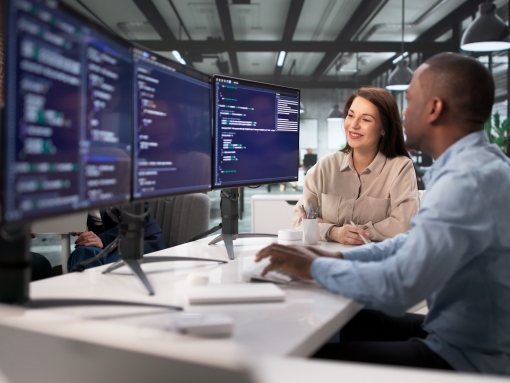 Diverse team of professionals collaborating during an AI training and workforce enablement session in a modern Frederick MD