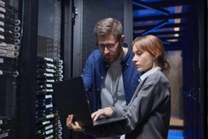 it professionals are examining server connections in a data center