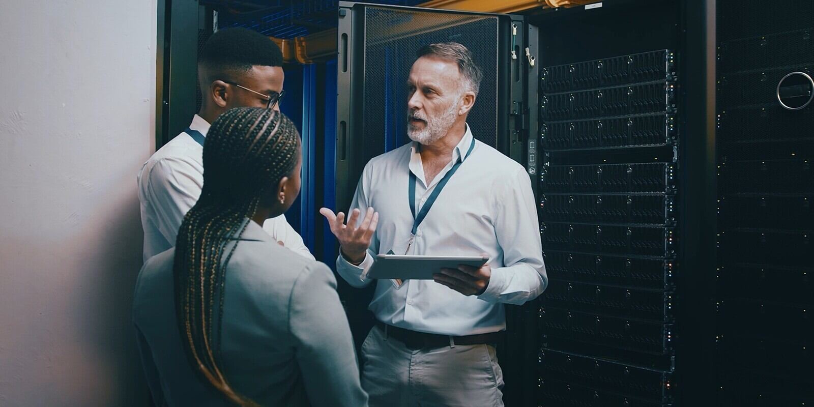 server room, training and manager with people on tablet for cybersecurity, diagnostics test and maintenance