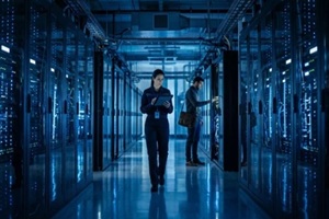 dedicated IT professionals working in a futuristic data center