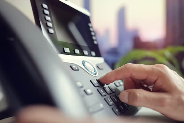 dialing a telephone in the office