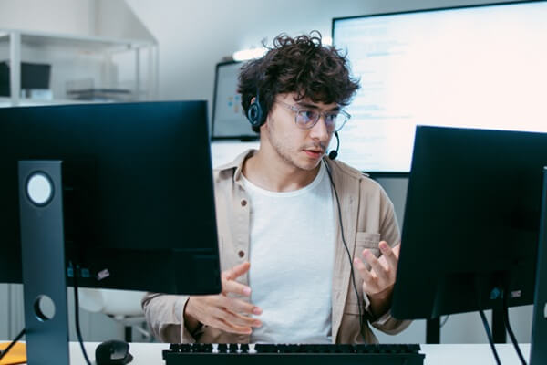 expert male customer service representative agent working in call center office