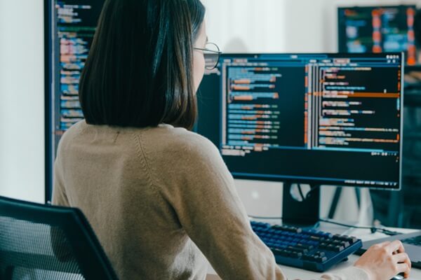 female freelance typing write prompt AI bot IT app smart program nomad