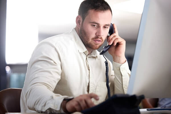 office and telephone call with communication, computer and press button for voip tech in night