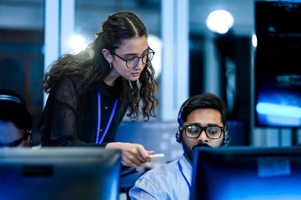service management specialist resolving technical support tickets with supervisor