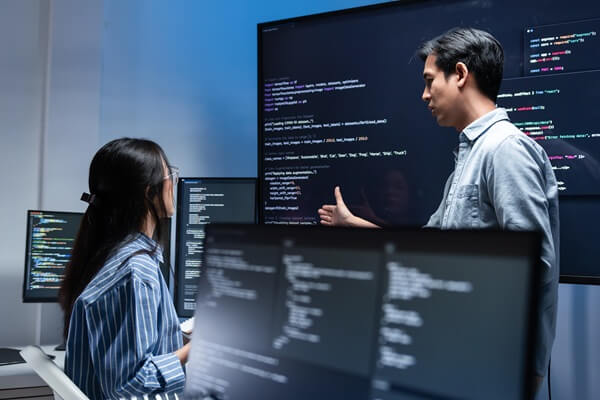 software developer team working late in office at night