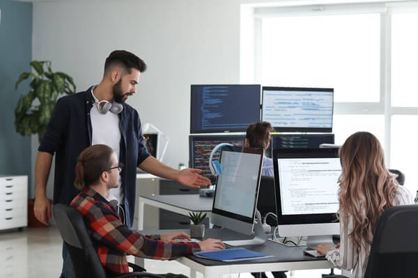 team of programmers working in office