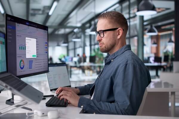 young professional managing cloud-based enterprise software system
