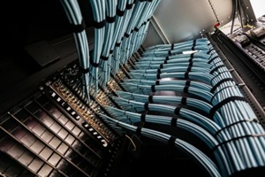 blue network cables in data center rack
