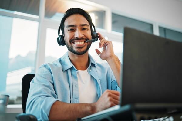 call center, portrait and man, consultant or business agent speaking on computer for technical support and advice