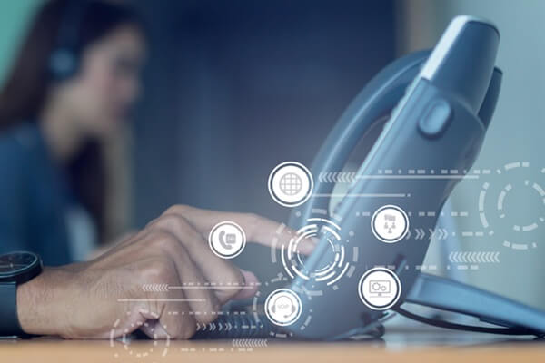 close up employee man hand press number on telephone for contact with virtual one stop business communication interface