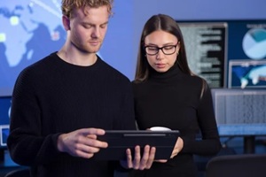 cybersecurity professionals analyzing data in a secure operations center