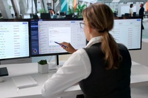 young woman working quickly on help desk tickets